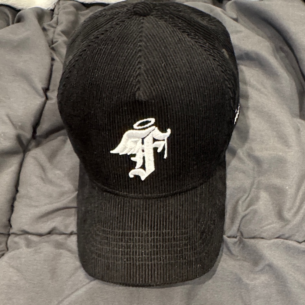 Elegant Black Corduroy Hat with Angelic Emblem